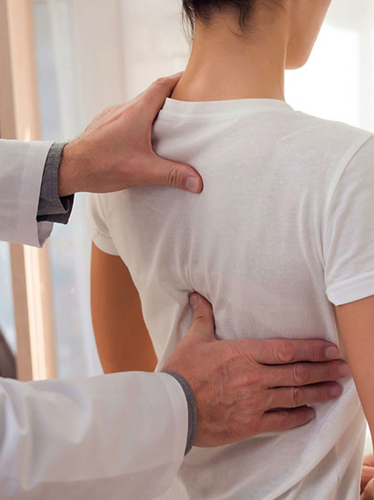 Female patient having a spinal decompression consultation