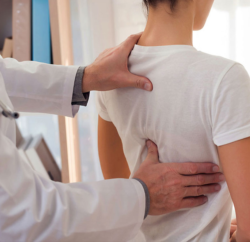 Female patient having a spinal decompression consultation